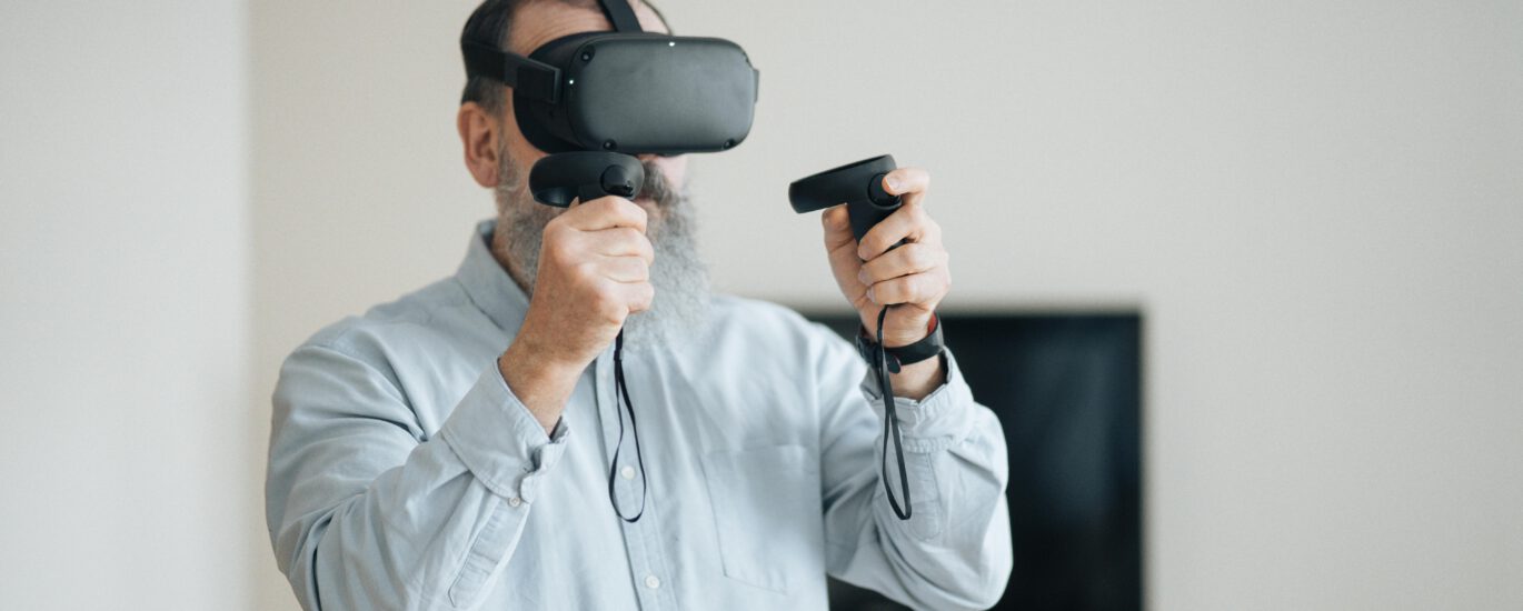 The future of language learning. Man is using VR Headset to learn a new language